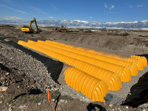 Storm drainage chambers, water booster stations and ditch reconfiguration services provided for new development Montana and Colorado